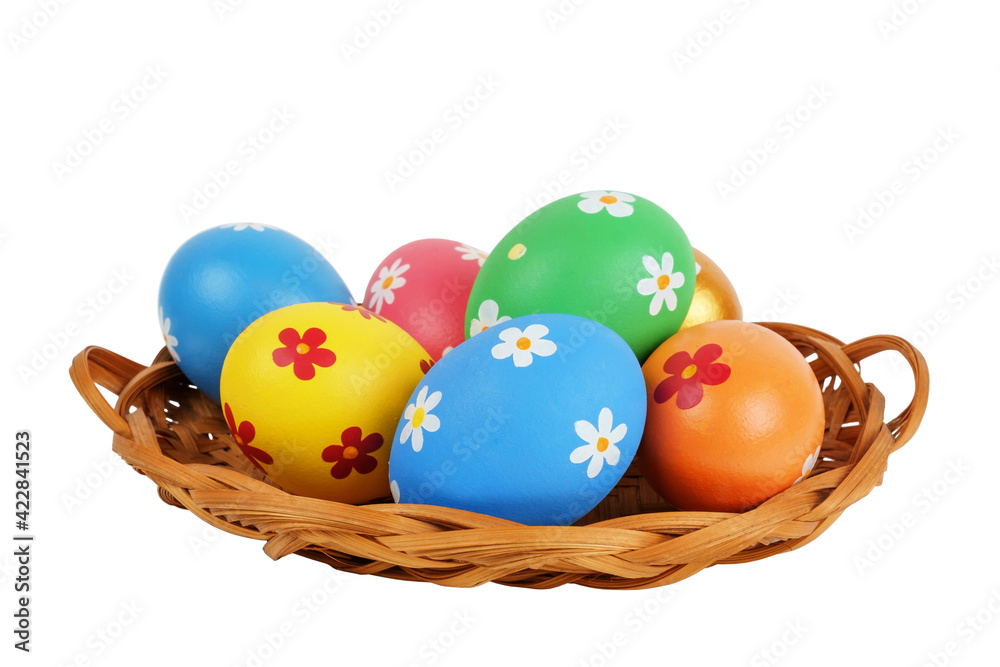Colorful painted Easter eggs in the basket on the white background, isolated