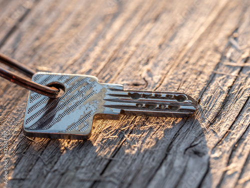 Isolated security key on wodden background