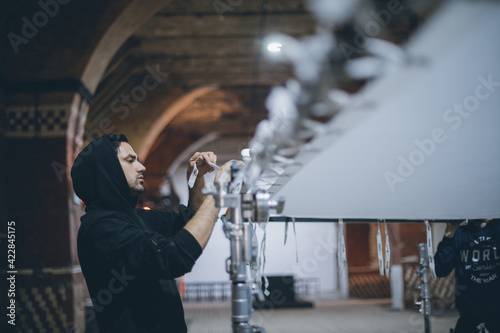 Illuminators with lighting equipment, lighting devices on the set. Lighting production for filming movies photo