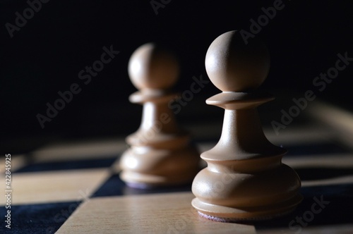 chess pieces illuminated in the dark
