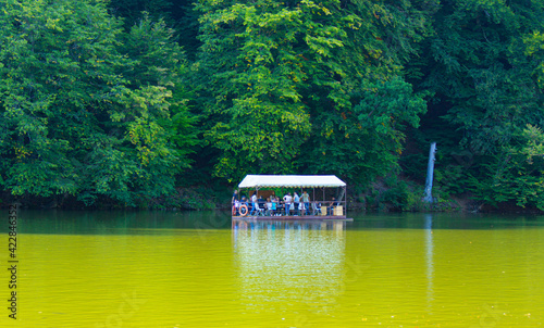 Parz Lich (Clear Lake) in Dilijan, Armenia.tourists traveling by boat. photo