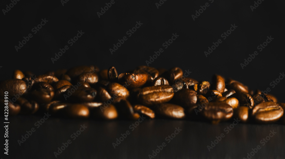 Brown Roasted Coffee Beans Closeup On Dark Background Brown Roasted Coffee Beans Closeup On Dark Background