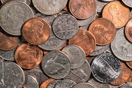 Close up of a pile of US coins shot from above photo