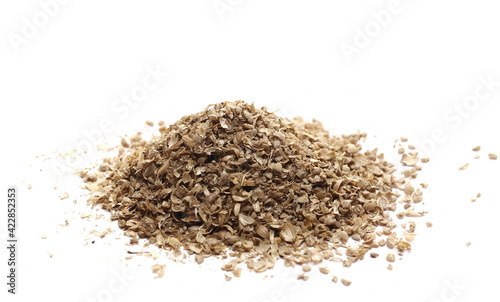 Coriander ground pile isolated on white background, side view