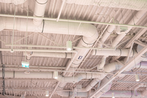 Air duct, wiring and plumbing in the mall. Air conditioner pipe, wiring pipe, and plumbing pipe system.
