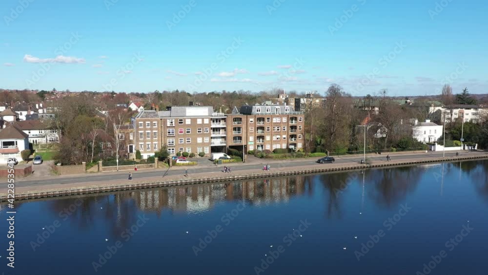 DESCENDING LOW ON CITY POND FULL OF BIRDS WITH BEAUTIFUL CITYSCAPE, EUROPE AERIALS DESCENDING LOW ON CITY POND FULL OF BIRDS WITH BEAUTIFUL CITYSCAPE, EUROPE AERIALS