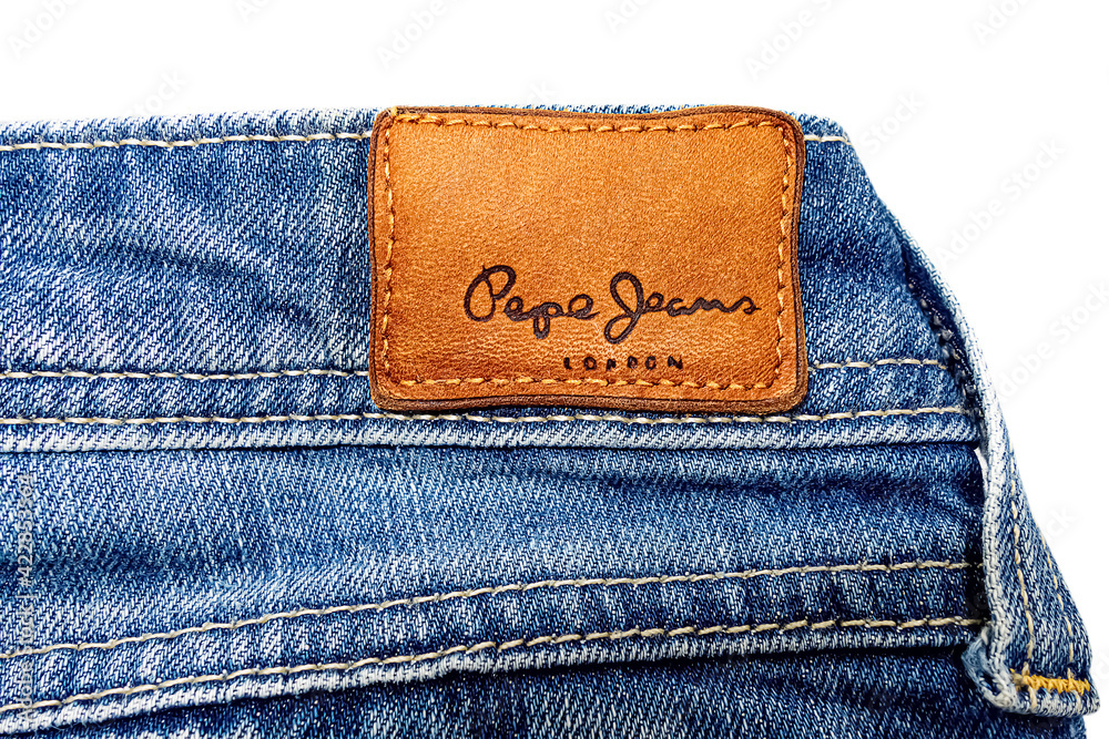 Brown Pepe Jeans label on blue denim clothes isolated on white background  Stock Photo | Adobe Stock