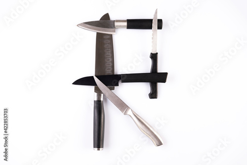 Alphabet made of knives isolated on white background. Letter 
