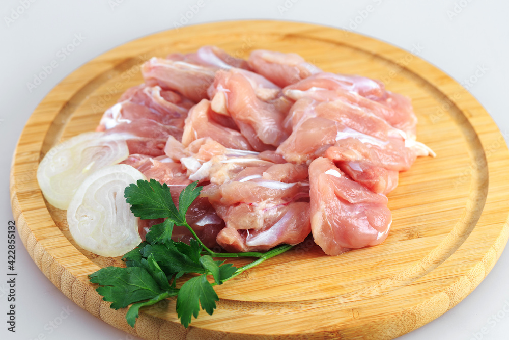 raw chicken goulash on white background raw chicken goulash on white background