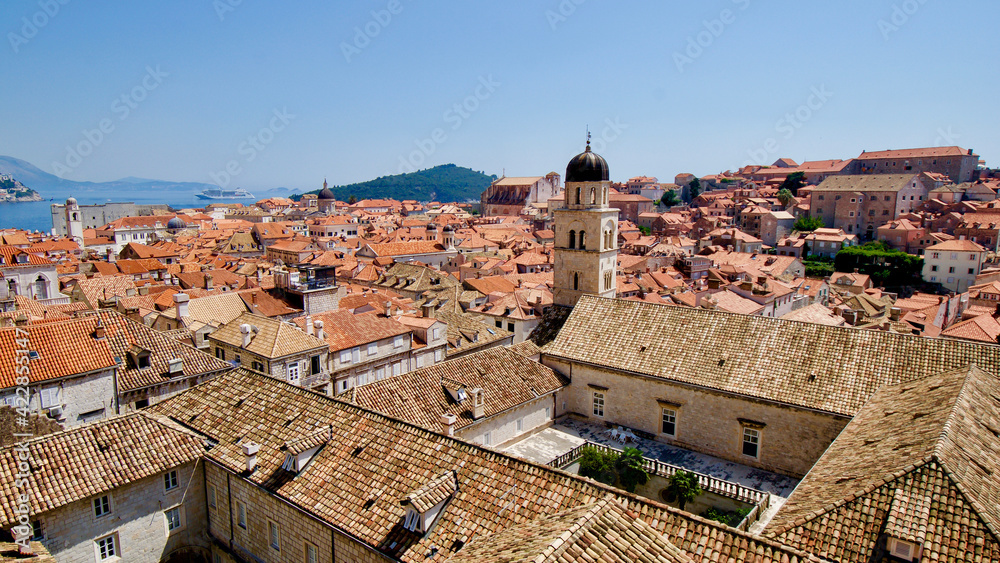 Houses and roofs of the historical medieval city centre of Dubrovnik, Croatia with in the background the Adriatic Sea.