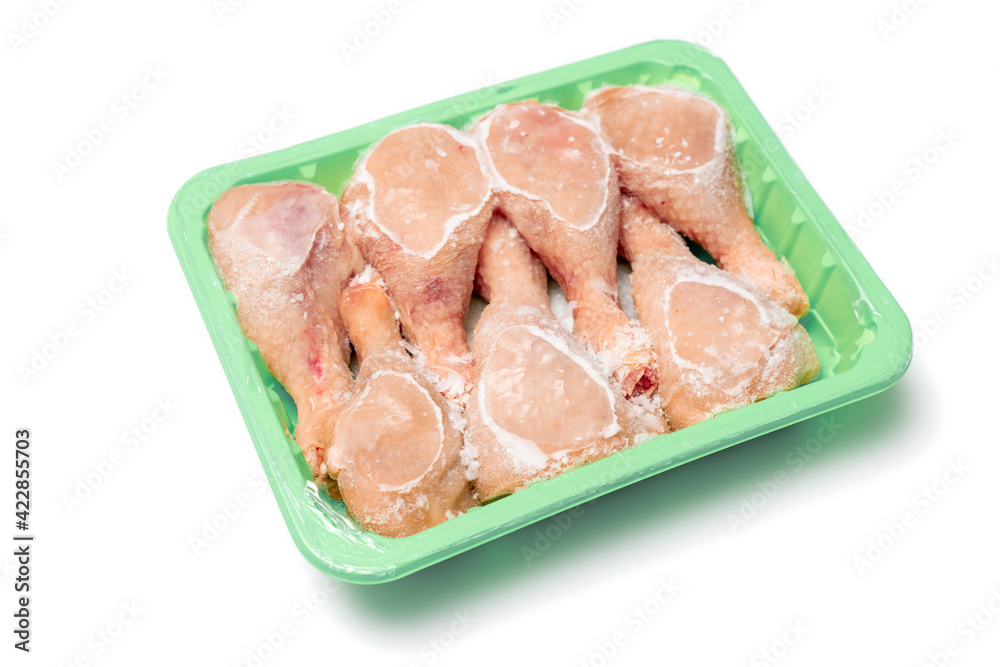 Fresh frozen chicken meat in an open package. Fresh frozen chicken meat in an open package.