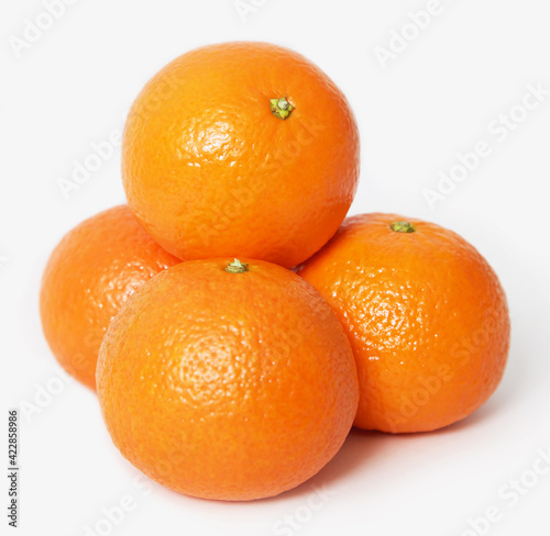 Four oranges isolated on white