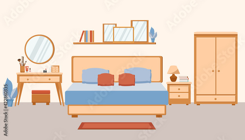 Cozy trendy bedroom interior. Large double bed, dressing table and wardrobe