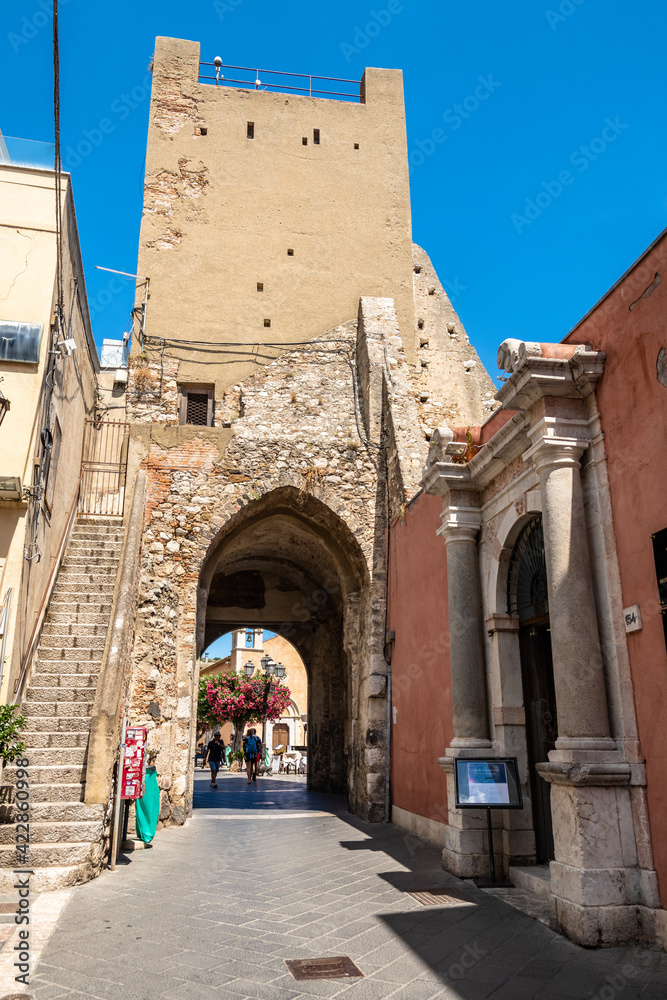 Clock tower and middle door in Taormina, Italy