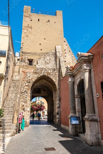 Clock tower and middle door in Taormina, Italy