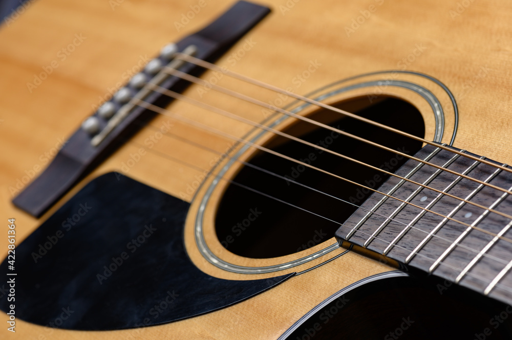 Man playing acoustic guitar, cover for online courses, learning at home. Man playing acoustic guitar, cover for online courses, learning at home.