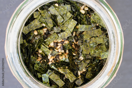 A jar of furikake, a Japanese condiment with dried nori seaweed and sesame seeds