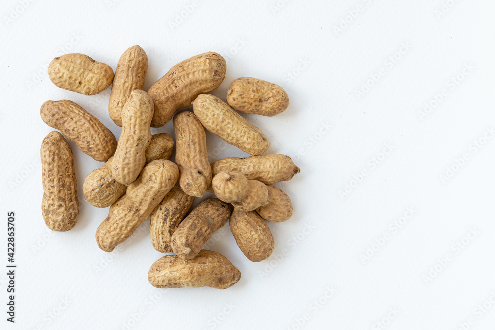 Peanuts or groundnuts in shells, isolated on a white background. Peanuts or groundnuts in shells, isolated on a white background.