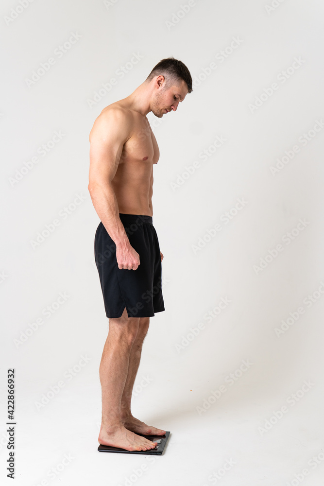 Man with weights health pondered, health and sports on a white background pain hurt spine man background human holding. Touching care, ain suffer attractive