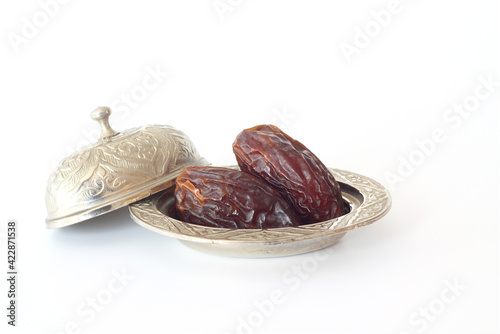 Wallpaper Mural Dried palm date fruits in a silver bowl on white background. Torontodigital.ca