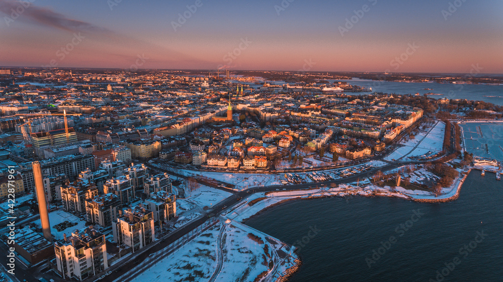Obraz premium Aerial shot of Helsinki in deep mid-winter sunset.