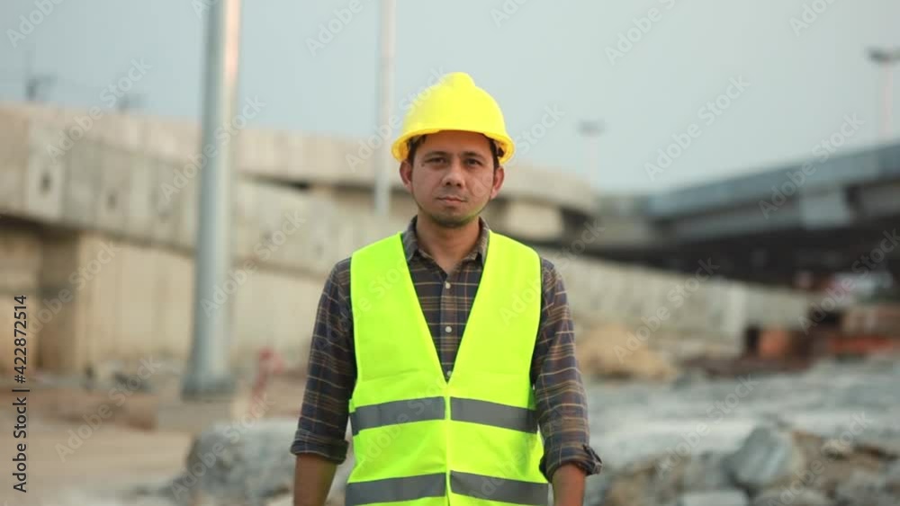 Asian construction worker walking construction site Asian construction worker walking construction site