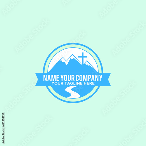 mountain emblem with cross logo