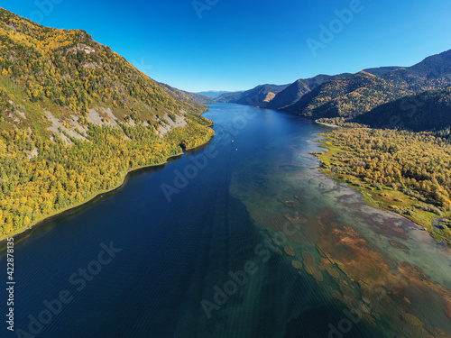 Fototapeta Naklejka Na Ścianę i Meble -  Altai mountains in autumn. Teletskoye lake at dawn. Aerial view.