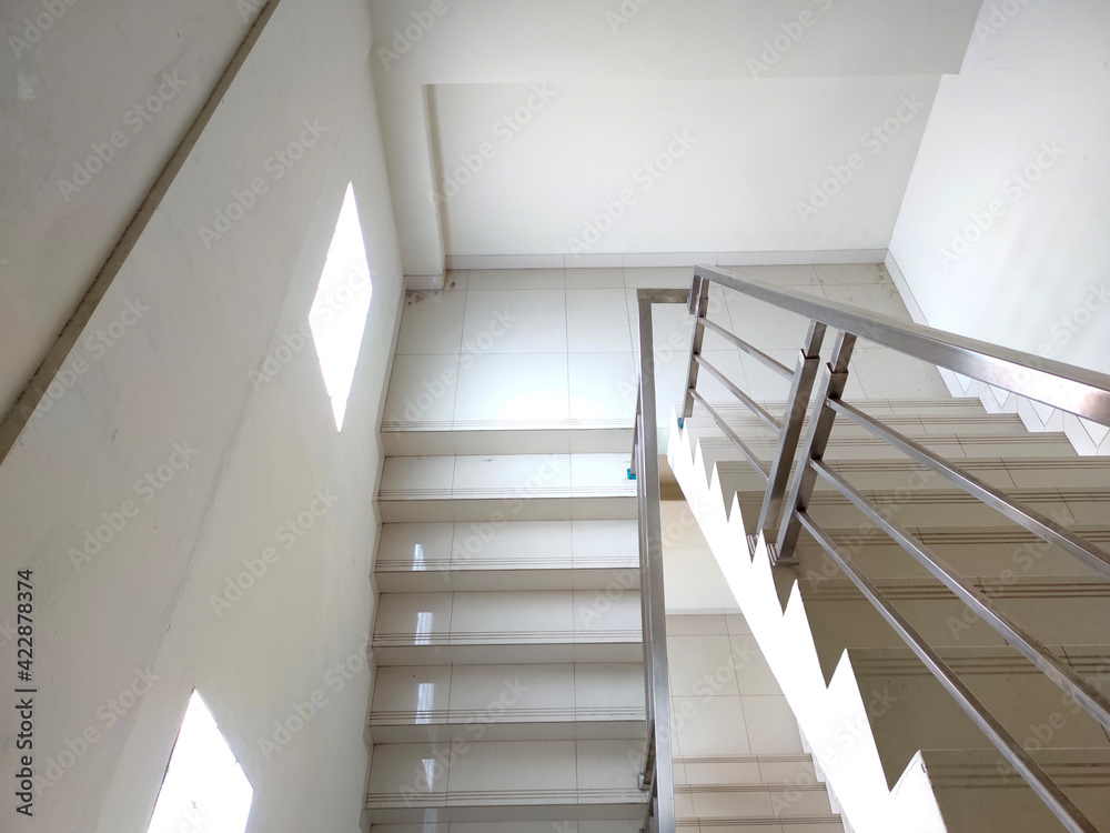 Staircase in the office with handle. Cement staircase building.
