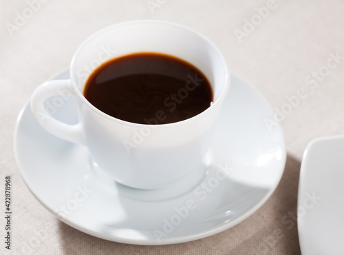Image of cup of fresh black coffee americano on table, no people