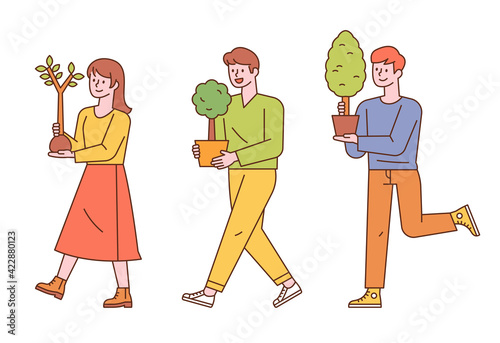 Three people are carrying a tree planted in a small pot. flat design style minimal vector illustration.