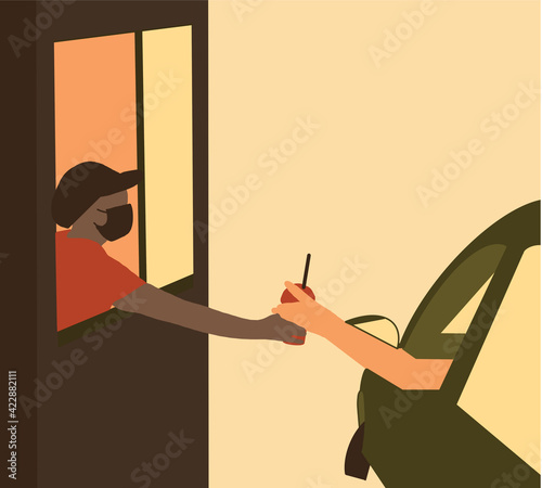 Drive thru and takeaway for buy fast food for protect covid19. New normal life style. Staff woman wearing mask and handed a food to customer. Drive through and take away concept.