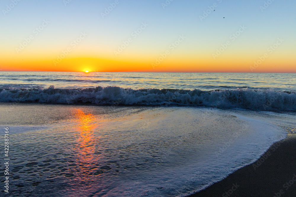 Myrtle Beach oceanfront sunrise with waves on the beach. Myrtle Beach oceanfront sunrise with waves on the beach.