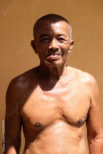 portrait of healthy indonesian senior man, world health day 2021 background