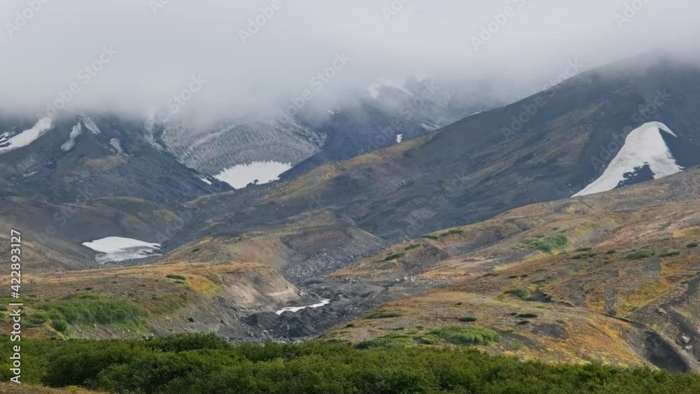 Landscape with the wild terrain of Kamchatka peninsula under clouds, Russia, 4k Landscape with the wild terrain of Kamchatka peninsula under clouds, Russia, 4k