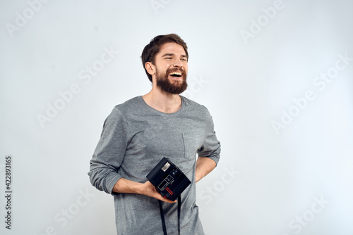 Male photographer holding a professional camera tasty technology hobby