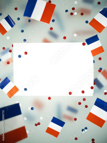 The national holiday of July 14 is a happy Independence Day of France, Bastille Day, the concept of patriotism, memory, confetti and flags, mockup, copy space