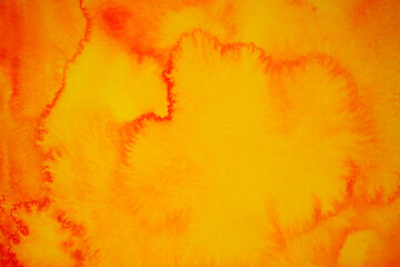 Beautiful red orange abstract background. Drawn, hand painted aquarelle. Wet watercolor pattern. Artistic background with copy space for design. Vivid web banner. Liquid, flow, fluid effect.