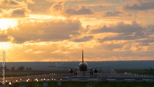 Airplane will take-off at an airport during sunset sky