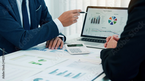 Group of business people analysis summary graph reports of business operating expenses and work data about the company's financial statements. photo