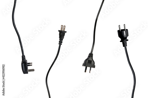 Four international black power plugs, isolated on white studio background