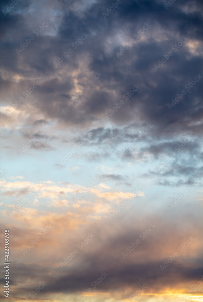 Rain clouds in the sky at sunset