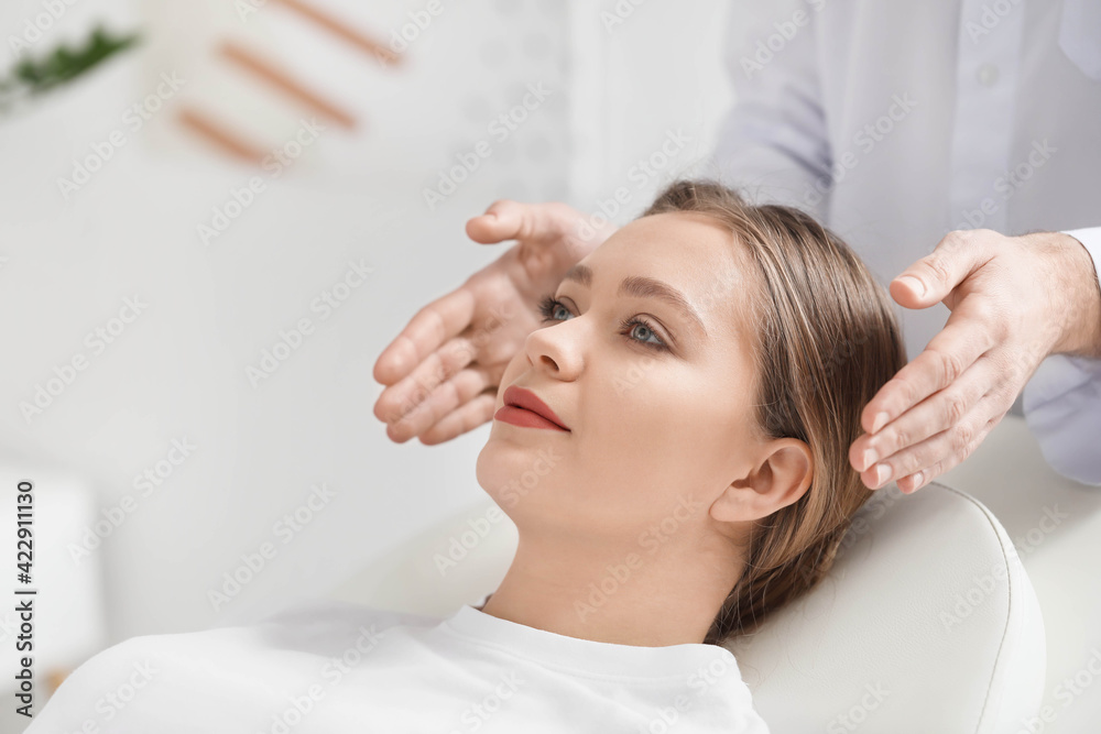 Fototapeta premium Reiki master working with patient