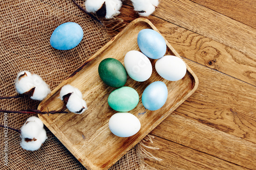 painted eggs decoration verbena wooden background top view