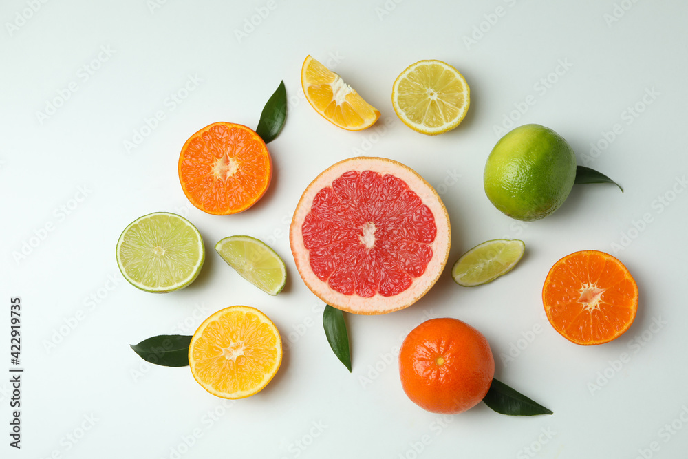 Fresh citrus with leaves on white background, top view Fresh citrus with leaves on white background, top view
