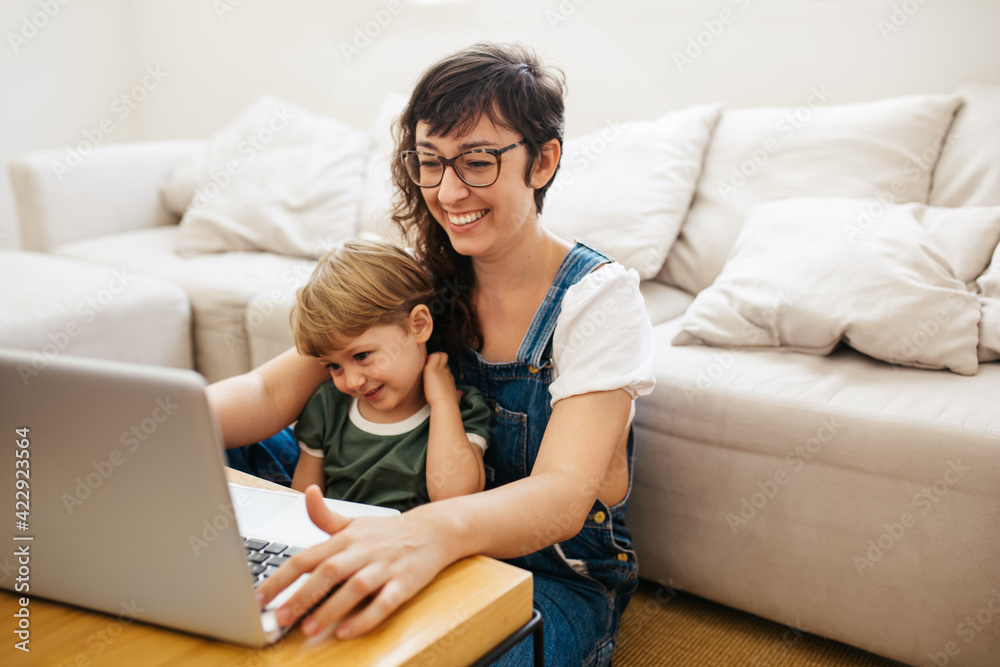 Mother working from home with son Mother working from home with son