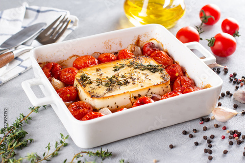 Photos Baked vegetables with feta cheese, olives, onions, Provencal herbs, olive oil, spices and tomatoes