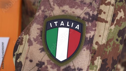 Europe, Italy , Milan March 2021 - 
vaccination with Astazeneca vaccine against Covid-19 Coronavirus continues - italian flag stamp on military uniform of the  army photo