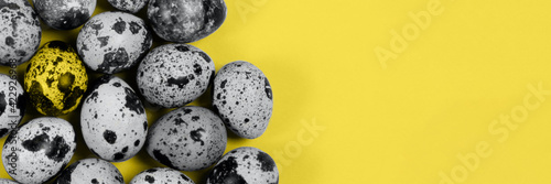 The easter background with the quail eggs in the trendy illuminating yellow and ultimate gray colors of the year, the banner. The unique concept.