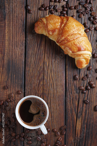 Black coffee and a croissant